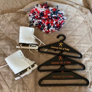 American girl skates hangers and 1 Pom Pom